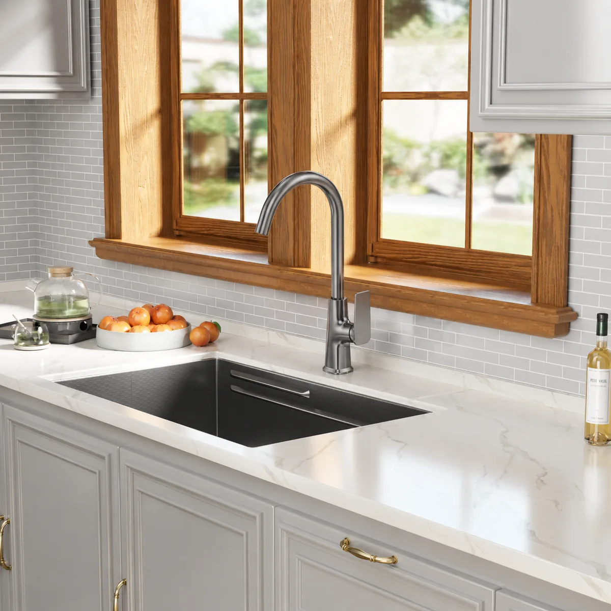 Single lever kitchen mixer tap with pull-down sprayer installed over an undermount kitchen sink